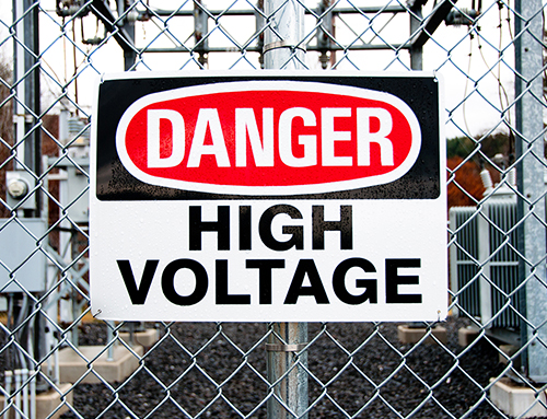 A sign on a home's chain link fence.